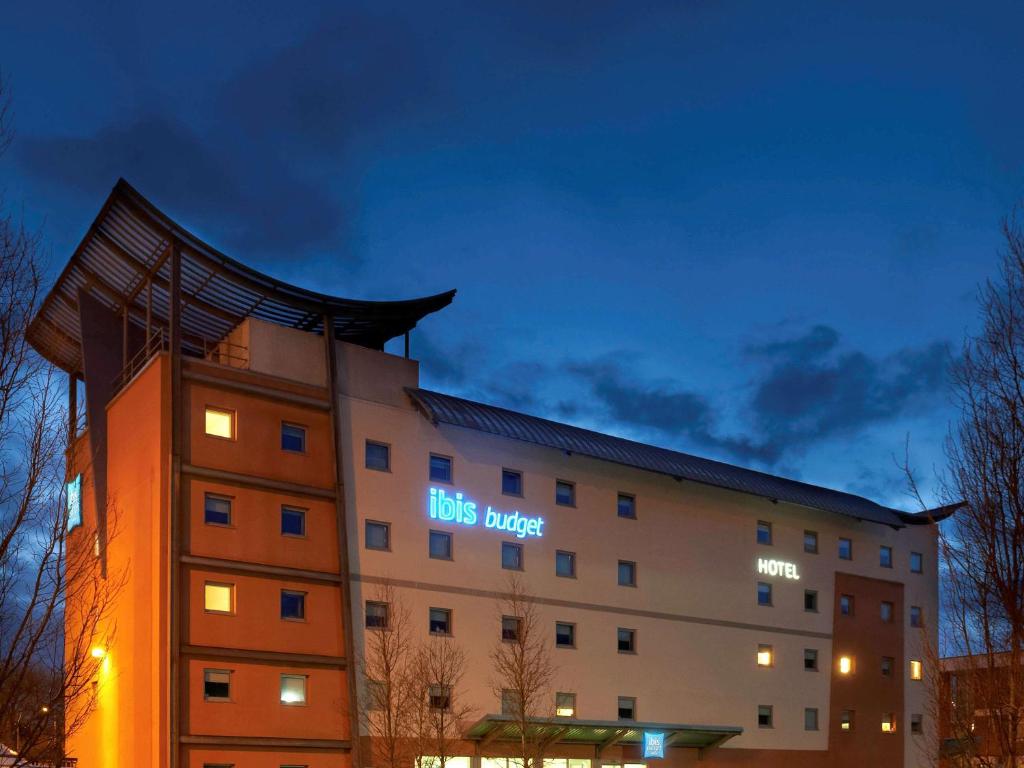 a building with a sign on the side of it at ibis budget Newport in Newport