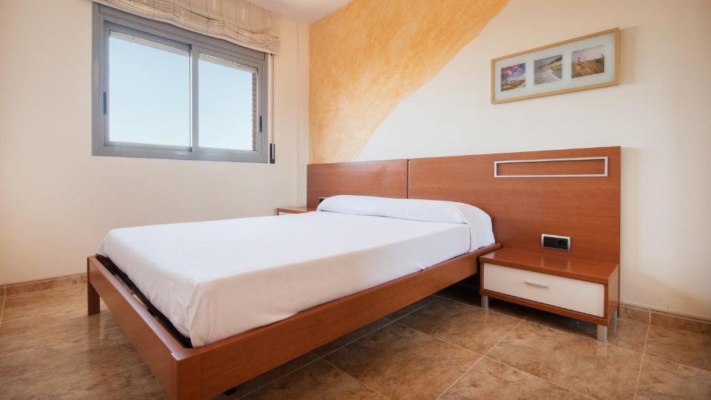 Postel nebo postele na pokoji v ubytování R34 Ático RAMBLA