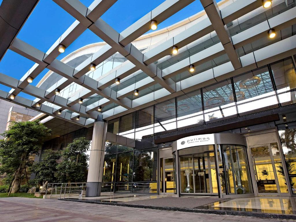 an office building with a glass ceiling at Pullman Xiamen Powerlong in Xiamen