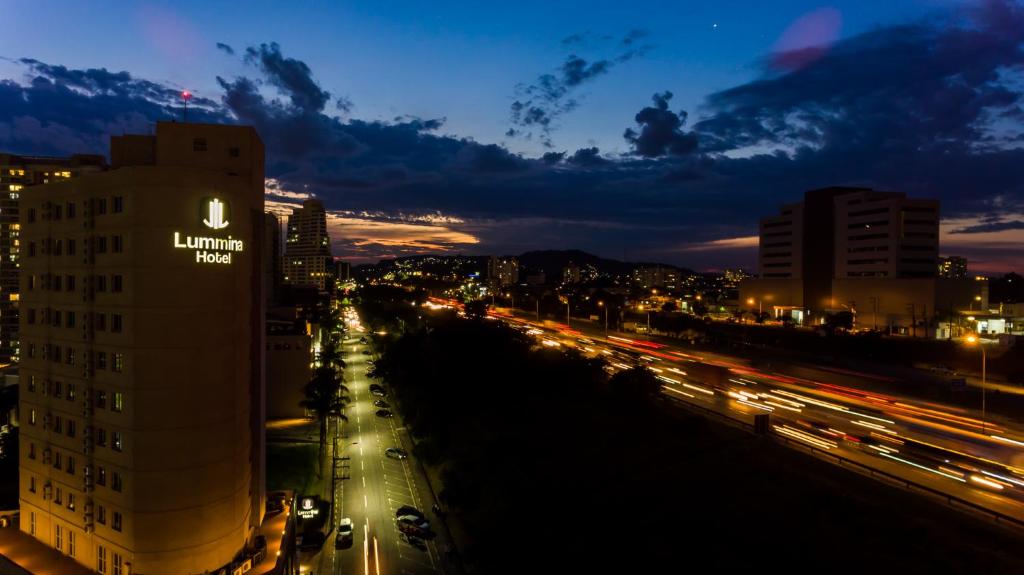 a view of a city at night with traffic at Lummina Barueri Alphaville in Barueri