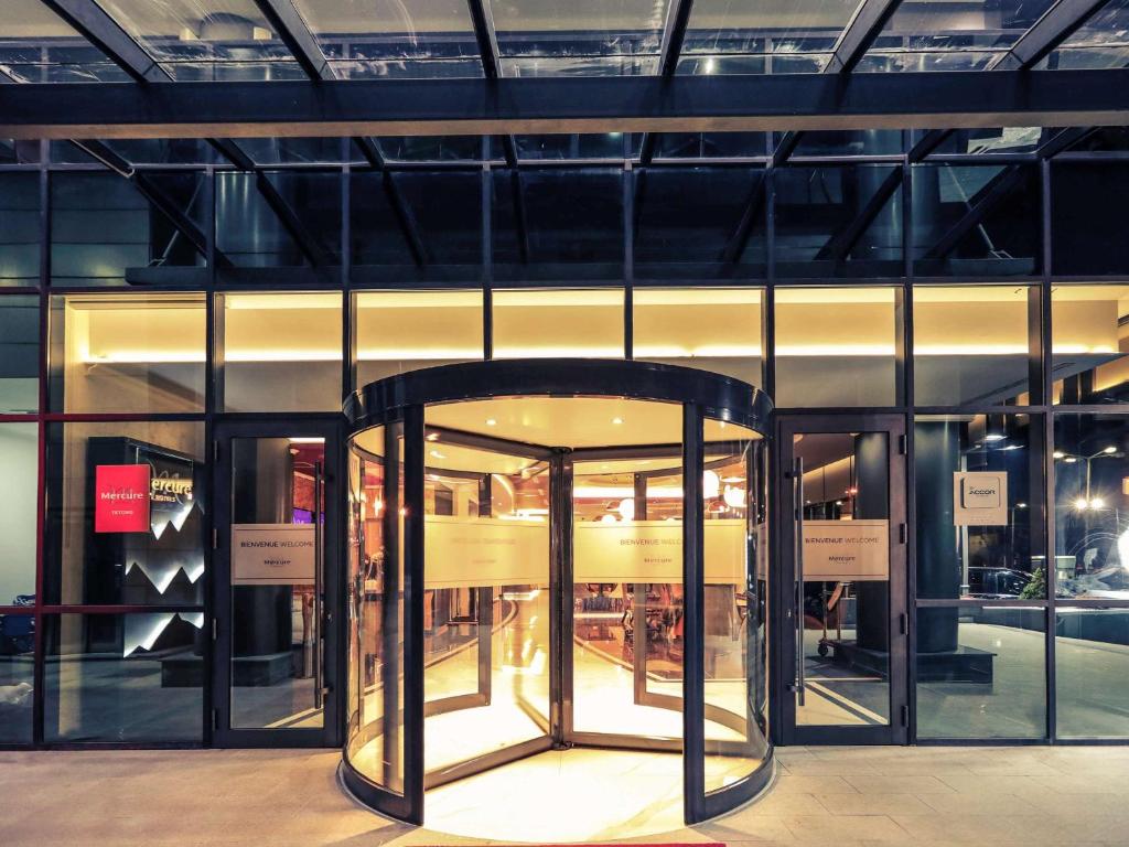 a store front with a revolving door in a building at Mercure Tetovo in Tetovo