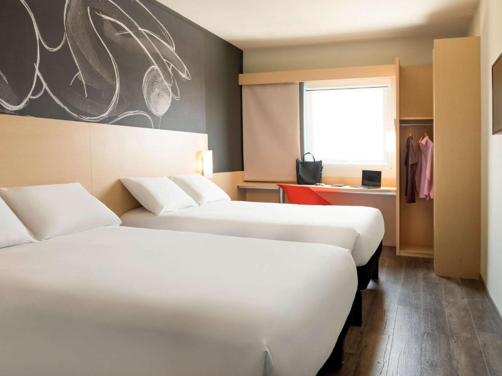 Postel nebo postele na pokoji v ubytování Ibis Irapuato