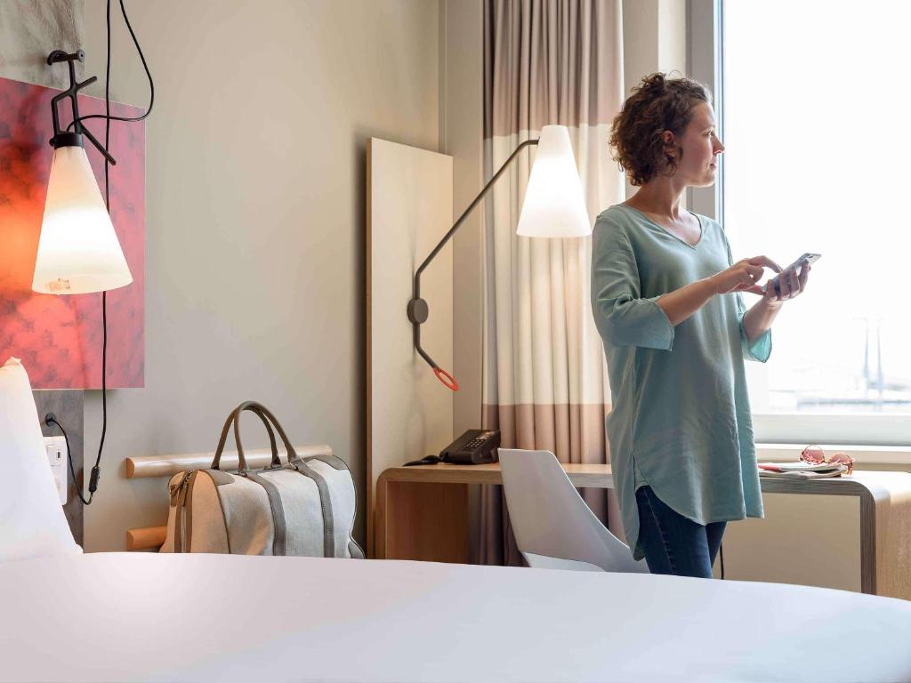 A bed or beds in a room at ibis Wien Hauptbahnhof