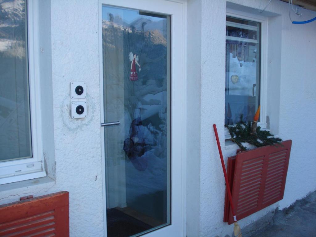 a door of a house with a window at Chalet Viola in Wengen