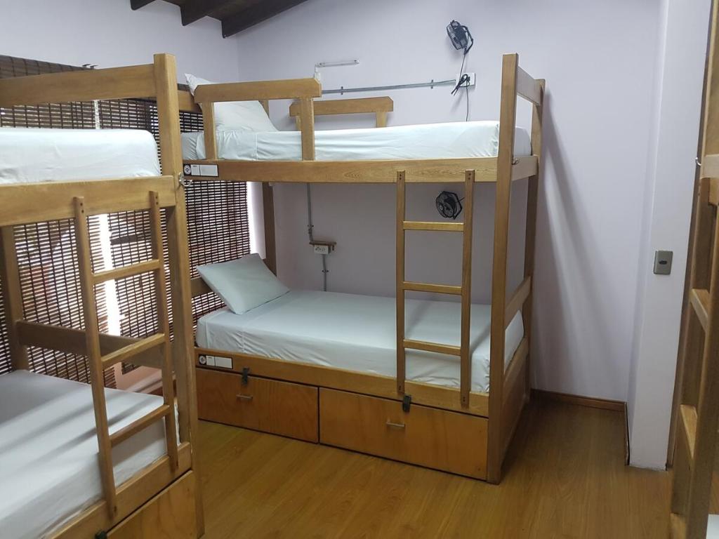Cama o camas de una habitación en Purple Monkey Hostel