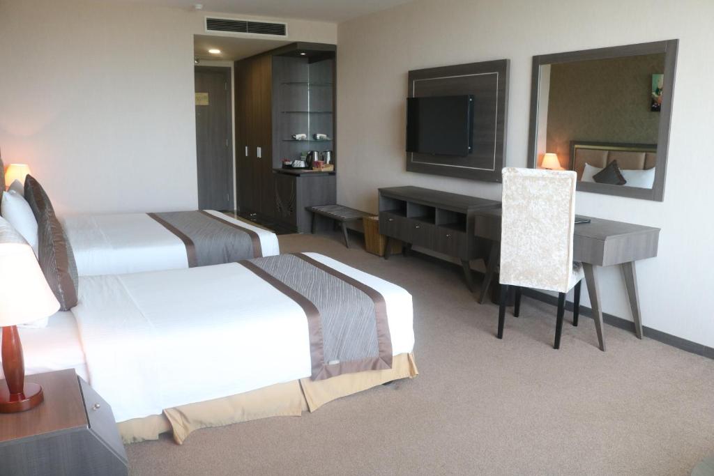 Postel nebo postele na pokoji v ubytování Muong Thanh Luxury Can Tho Hotel