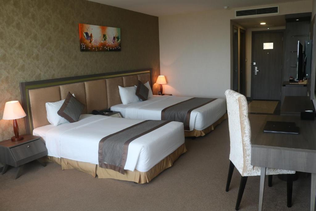 Postel nebo postele na pokoji v ubytování Muong Thanh Luxury Can Tho Hotel
