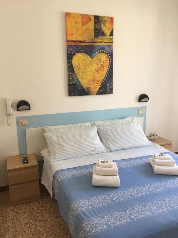Postel nebo postele na pokoji v ubytování Hotel Villa Rinaldini