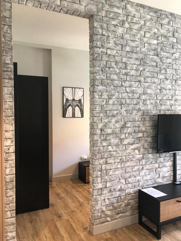 TV a/nebo společenská místnost v ubytování Property Apart - Soft Lofty Legnicka Centrum