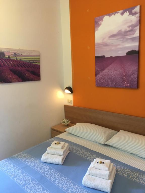 Postel nebo postele na pokoji v ubytování Hotel Villa Rinaldini