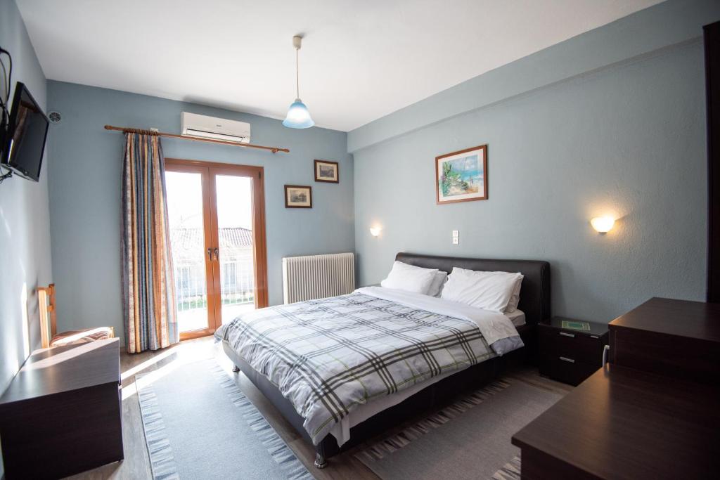 Ένα ή περισσότερα κρεβάτια σε δωμάτιο στο Domus Inn