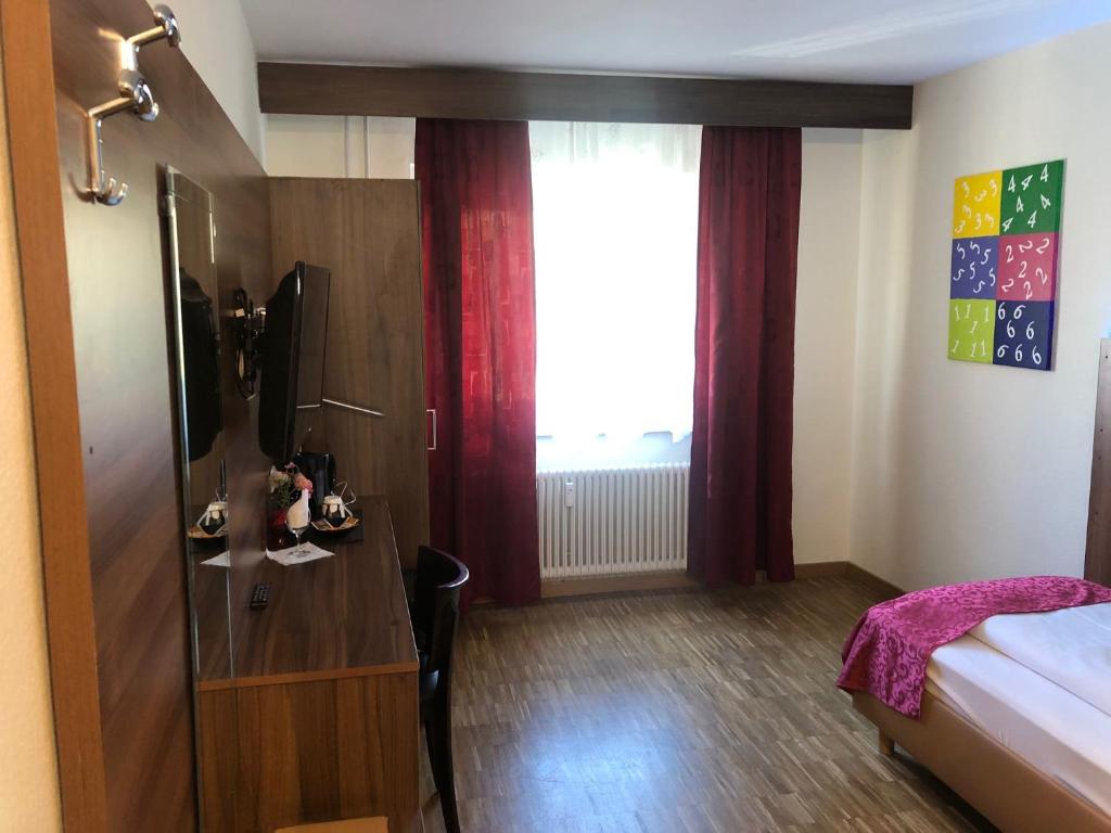 Postel nebo postele na pokoji v ubytování Hotel Post