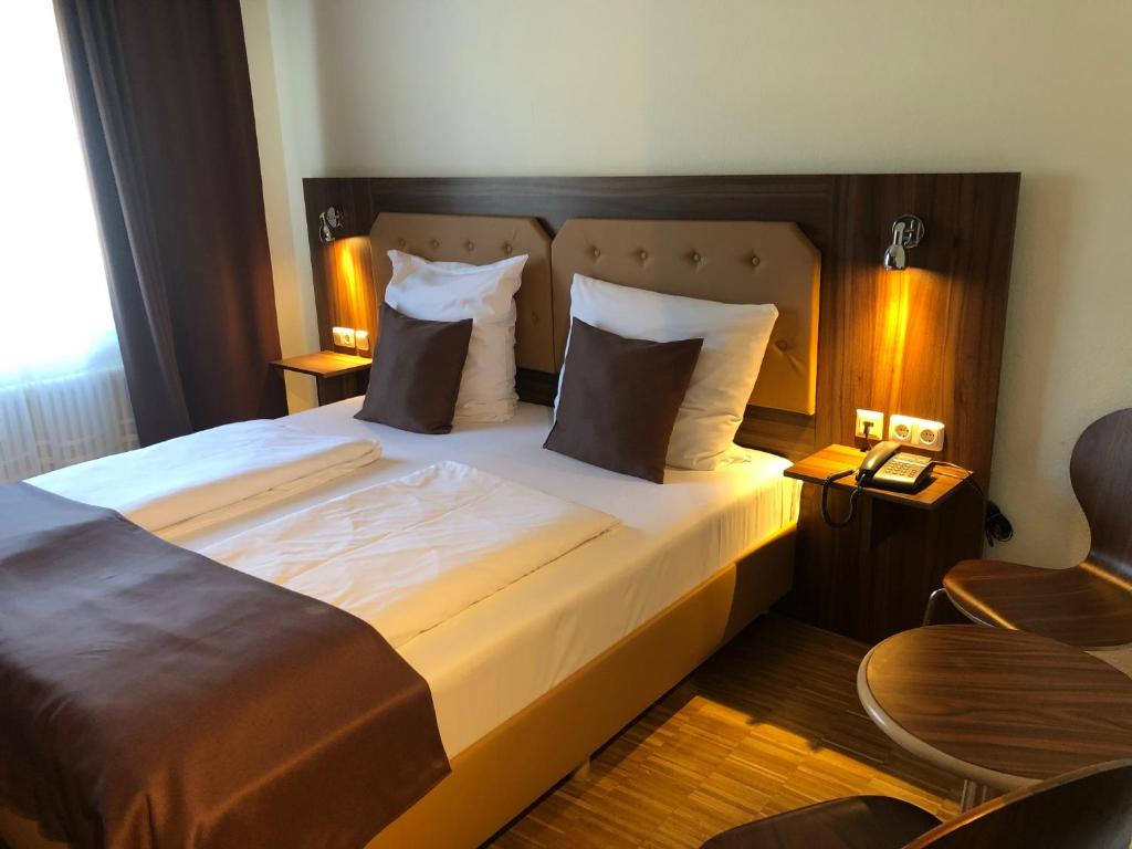 Postel nebo postele na pokoji v ubytování Hotel Post