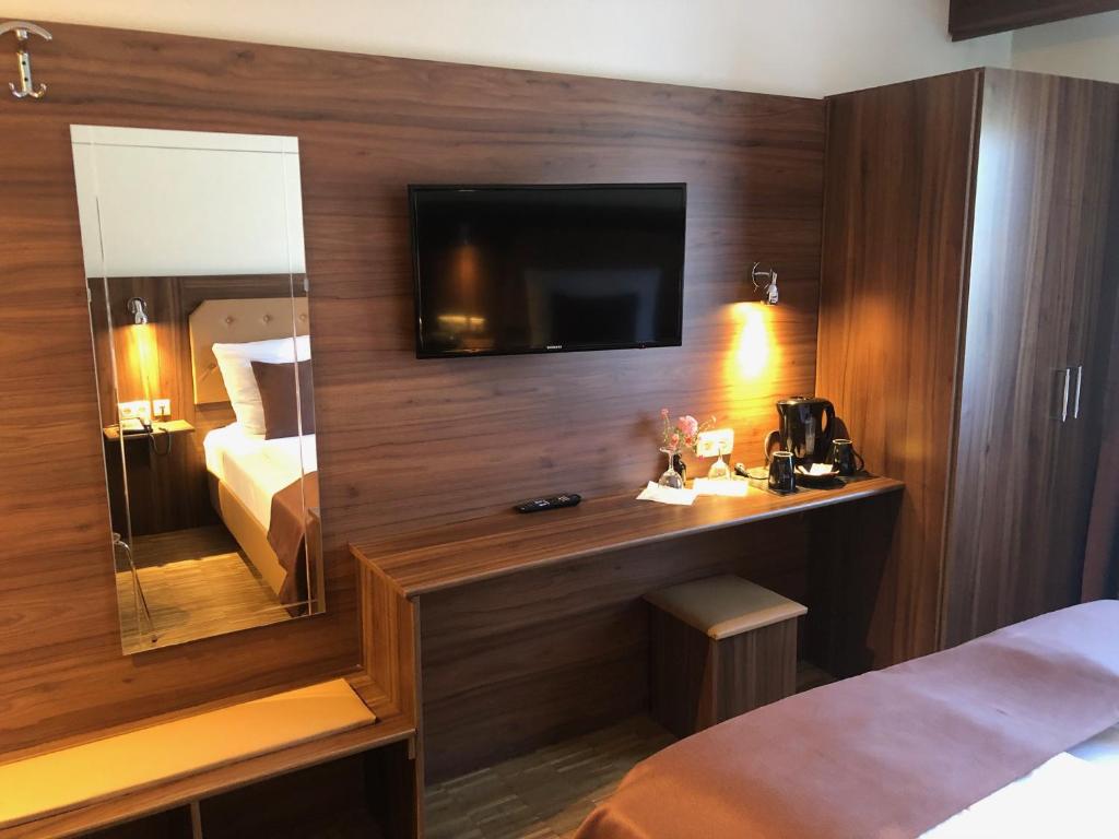 Postel nebo postele na pokoji v ubytování Hotel Post