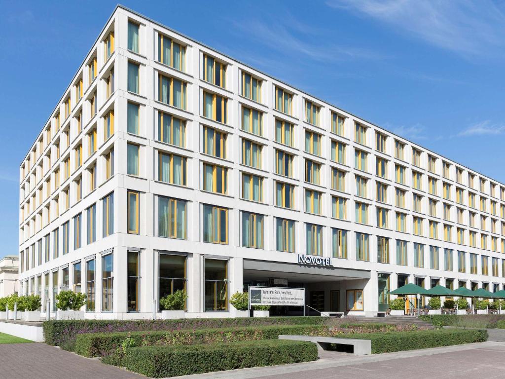 a large white building with a lot of windows at Novotel Karlsruhe City in Karlsruhe