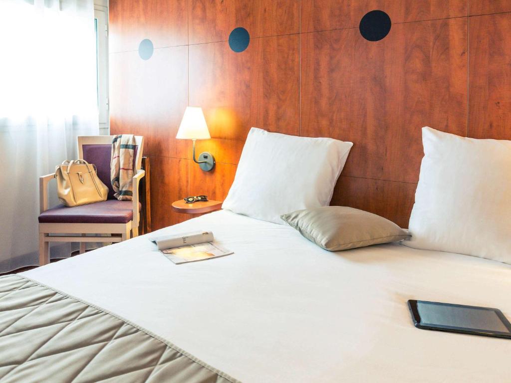 Postel nebo postele na pokoji v ubytování Mercure Béziers