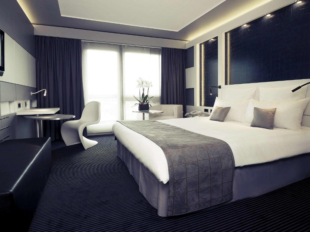 Postel nebo postele na pokoji v ubytování Mercure Biel