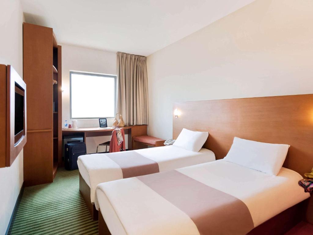 Postel nebo postele na pokoji v ubytování ibis Amman