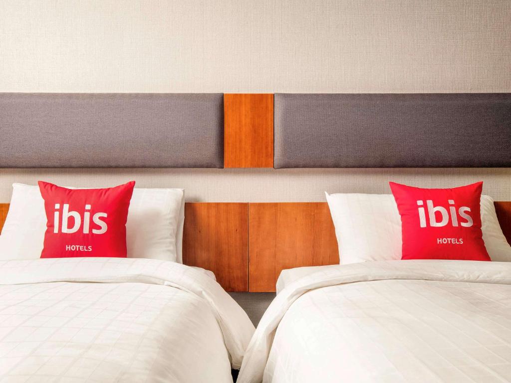 Postel nebo postele na pokoji v ubytování Ibis Ambassador Myeongdong