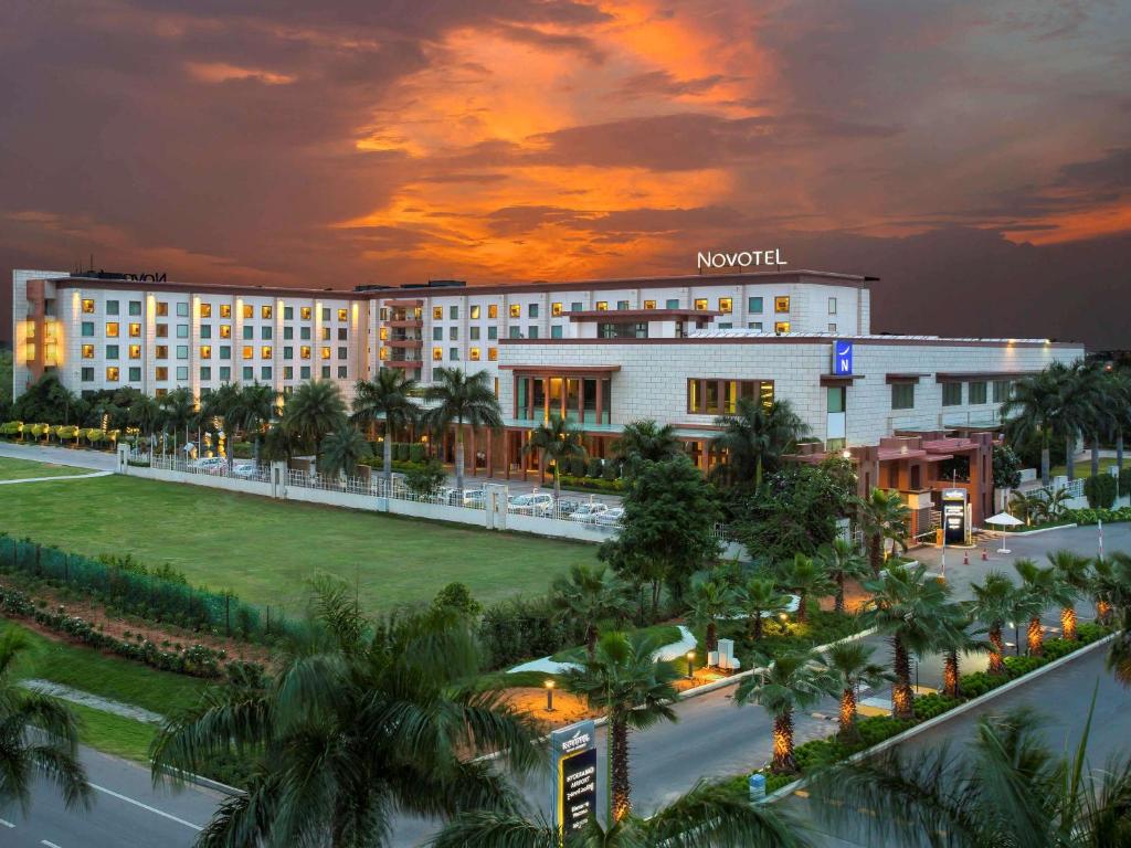 a rendering of the mgm hotel at sunset at Novotel Hyderabad Airport in Hyderabad