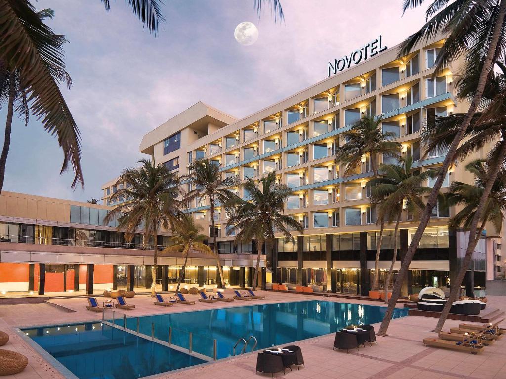 a rendering of a hotel with a swimming pool at Novotel Mumbai Juhu Beach in Mumbai