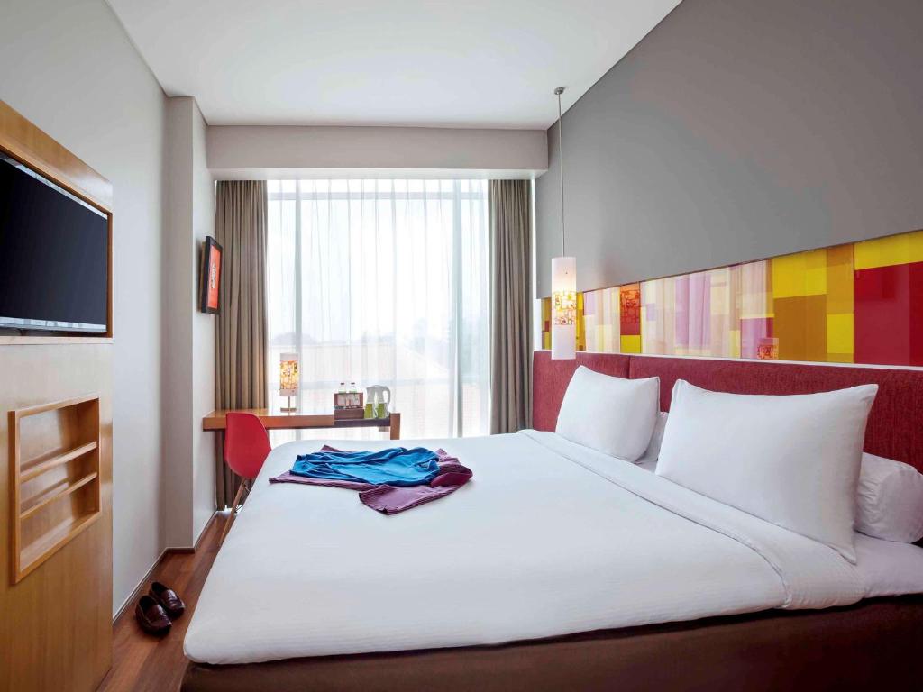 Postel nebo postele na pokoji v ubytování Ibis Styles Solo