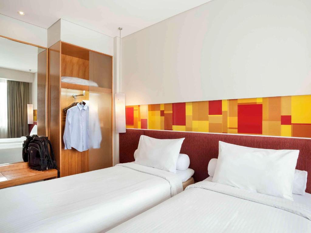 Postel nebo postele na pokoji v ubytování Ibis Styles Solo