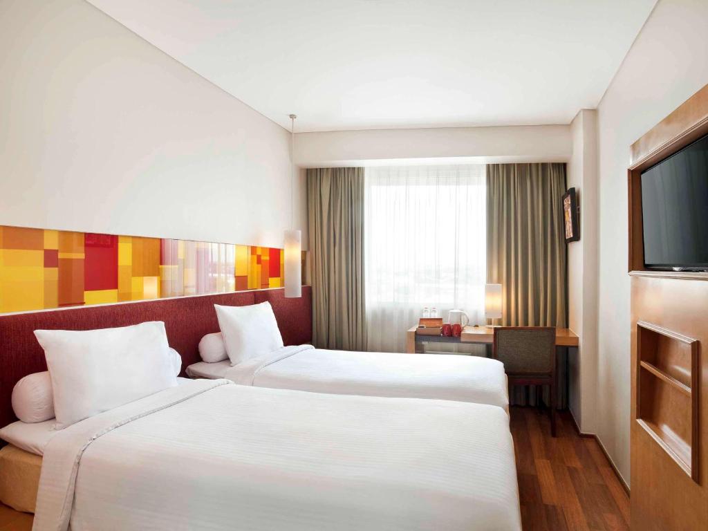 Postel nebo postele na pokoji v ubytování Ibis Styles Solo
