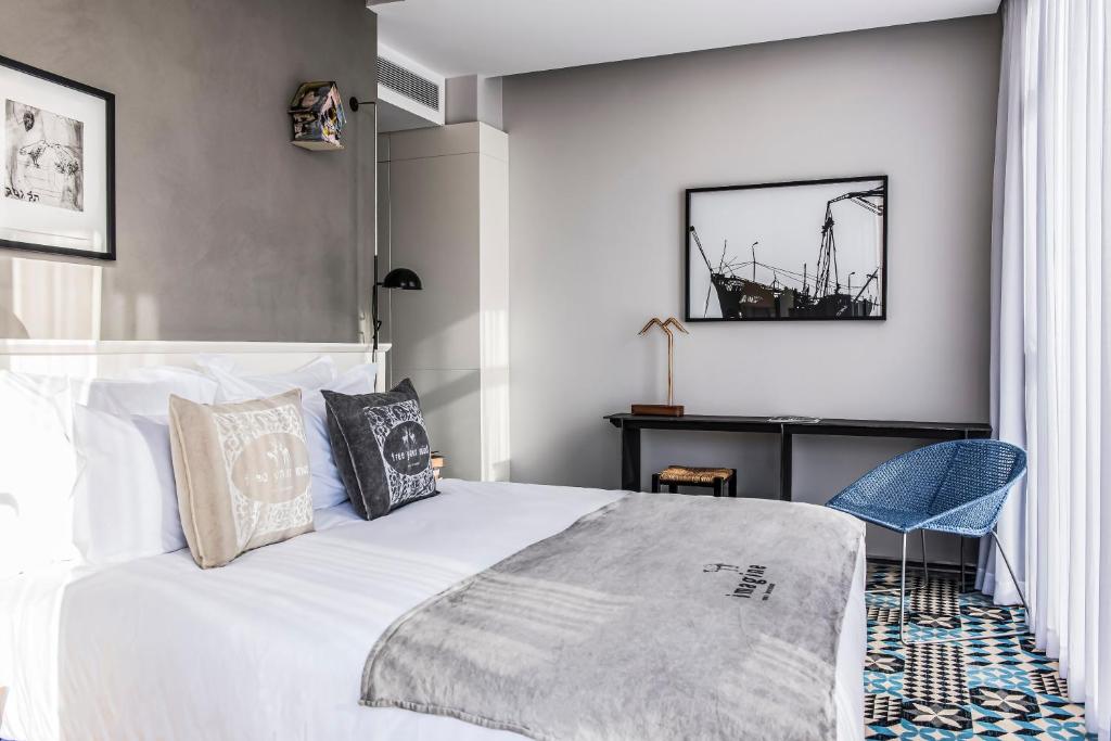 Postel nebo postele na pokoji v ubytování Bezalel Hotel - an Atlas Boutique Hotel