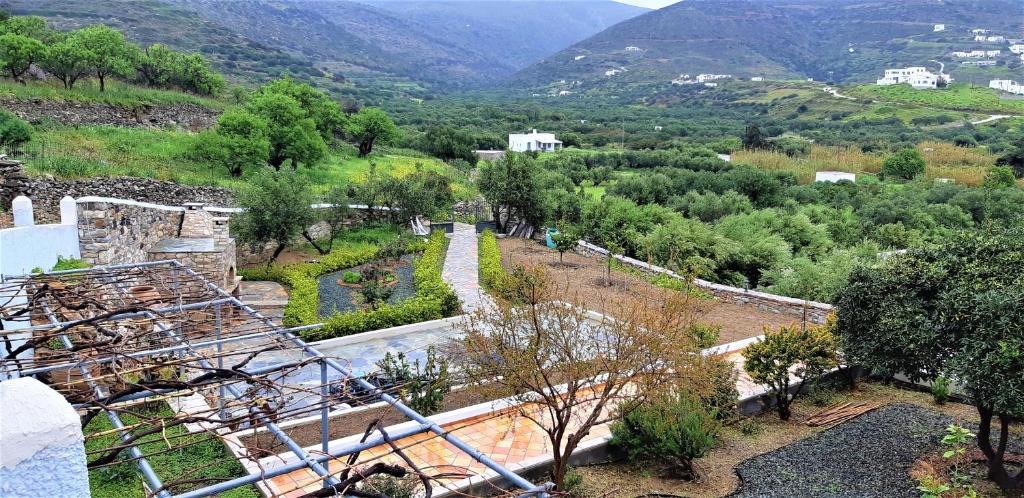 a view of a valley with trees and mountains at St.George Valsamitis in Katapola