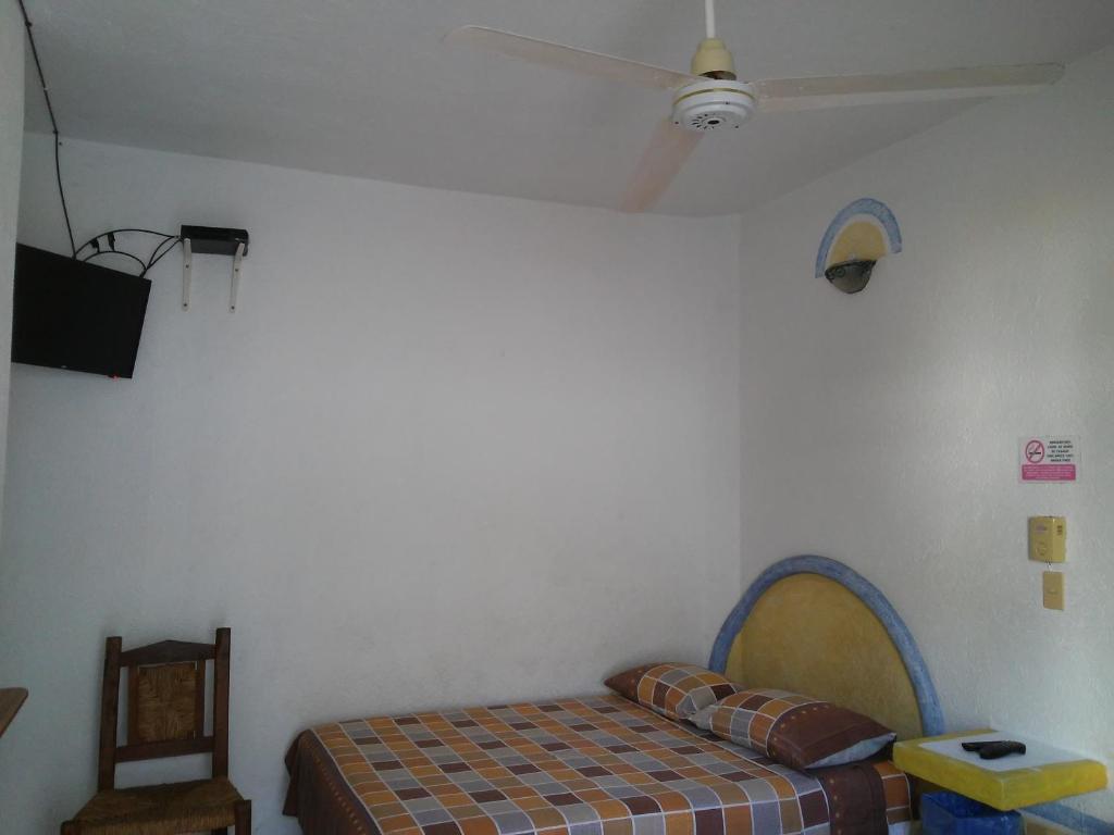 Postel nebo postele na pokoji v ubytování Hotel Sarabi