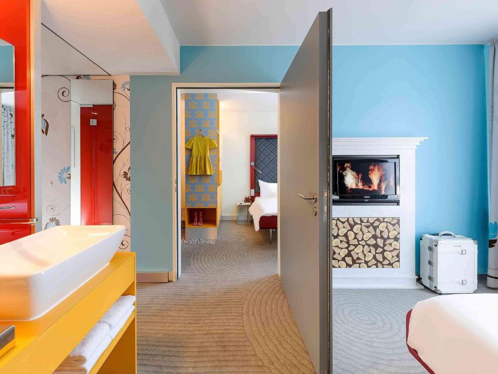 Postel nebo postele na pokoji v ubytování ibis Styles Hotel Berlin Mitte