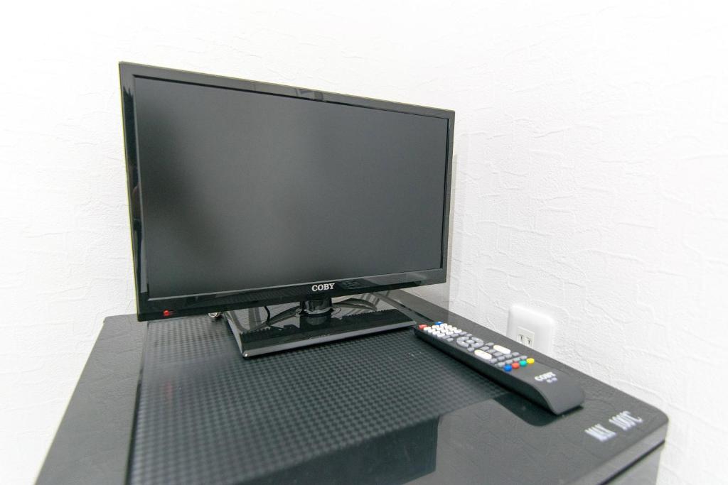 TV a/nebo společenská místnost v ubytování RUMa INN Rokugoudote