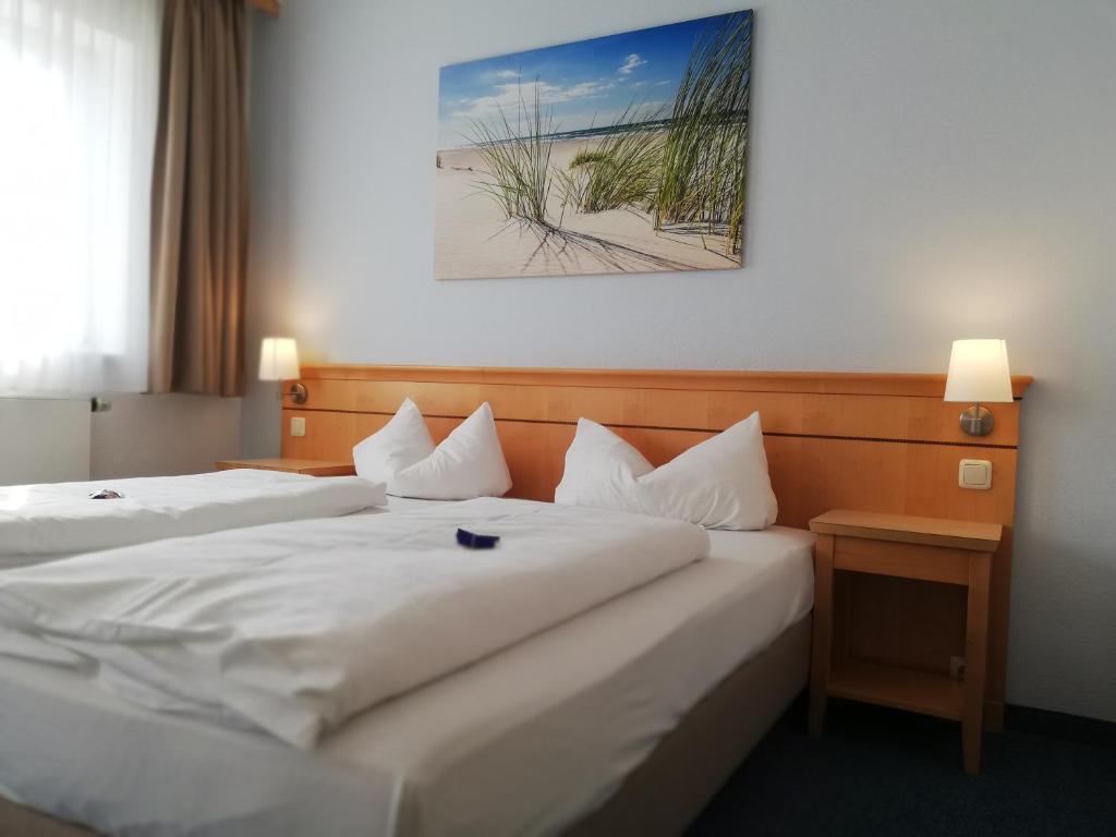 Postel nebo postele na pokoji v ubytování Hotel Nummerhof