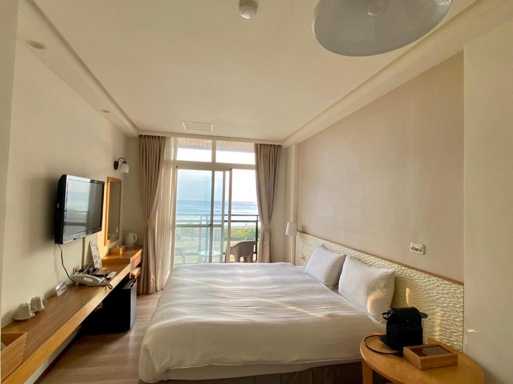 Postel nebo postele na pokoji v ubytování LoveSea 126 Beach Inn