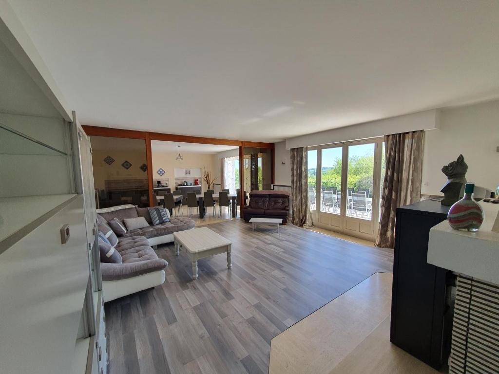 a living room with a couch and a table at La Marquière - Gite Val de Loire in Onzain