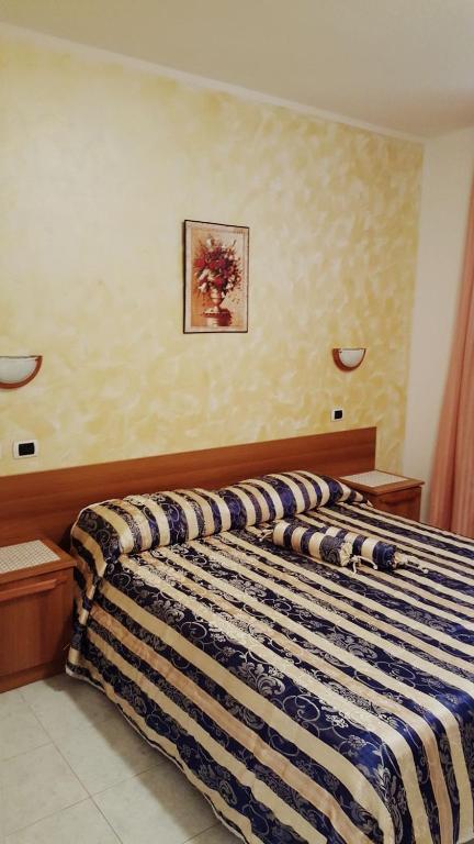 Postel nebo postele na pokoji v ubytování Sogno Sulcitano Masainas