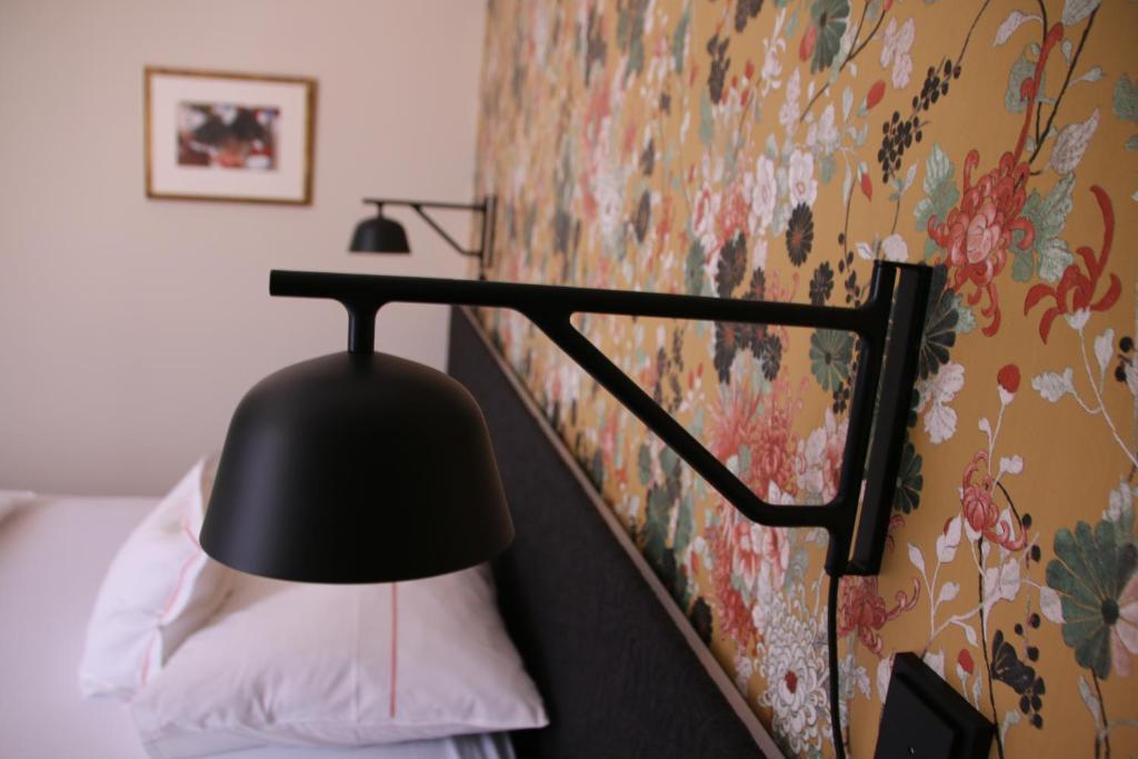 Postel nebo postele na pokoji v ubytování Hotel am Torturm