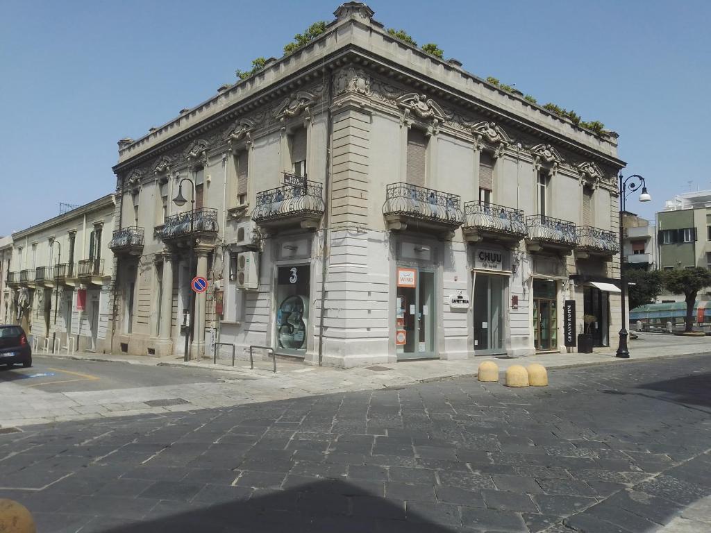 a large building on a city street at Al Torrione B&B in Reggio Calabria