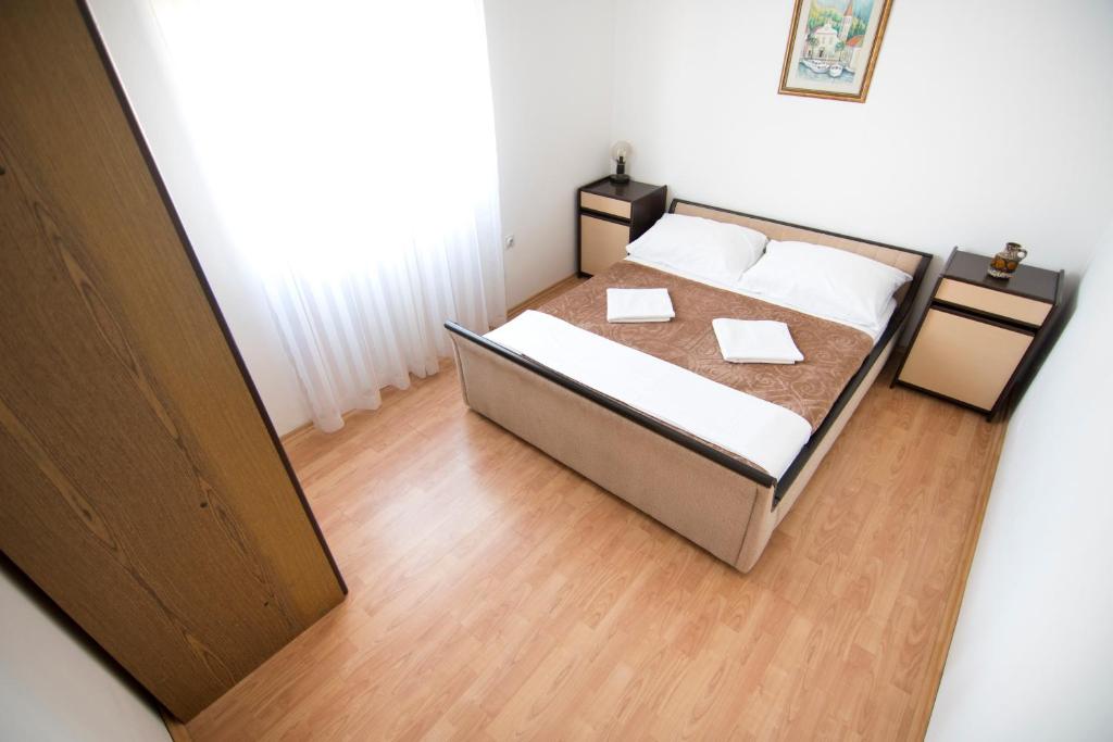 Posteľ alebo postele v izbe v ubytovaní Apartmani Jurić