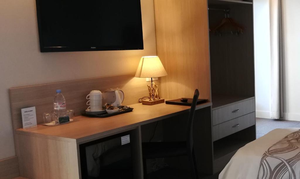 Postel nebo postele na pokoji v ubytování Hotel Le Léman