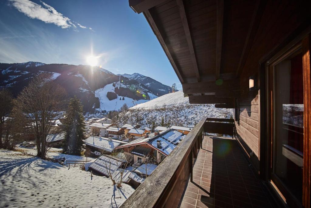 a balcony with a view of a snow covered mountain at Apartment Panorama in Saalbach Hinterglemm
