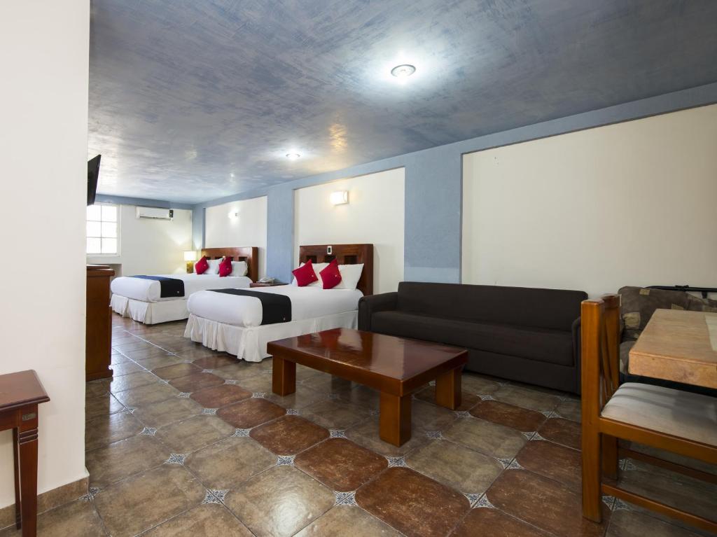 Postel nebo postele na pokoji v ubytování Suites de Reyes