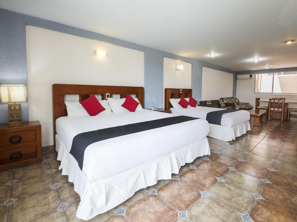 Postel nebo postele na pokoji v ubytování Suites de Reyes