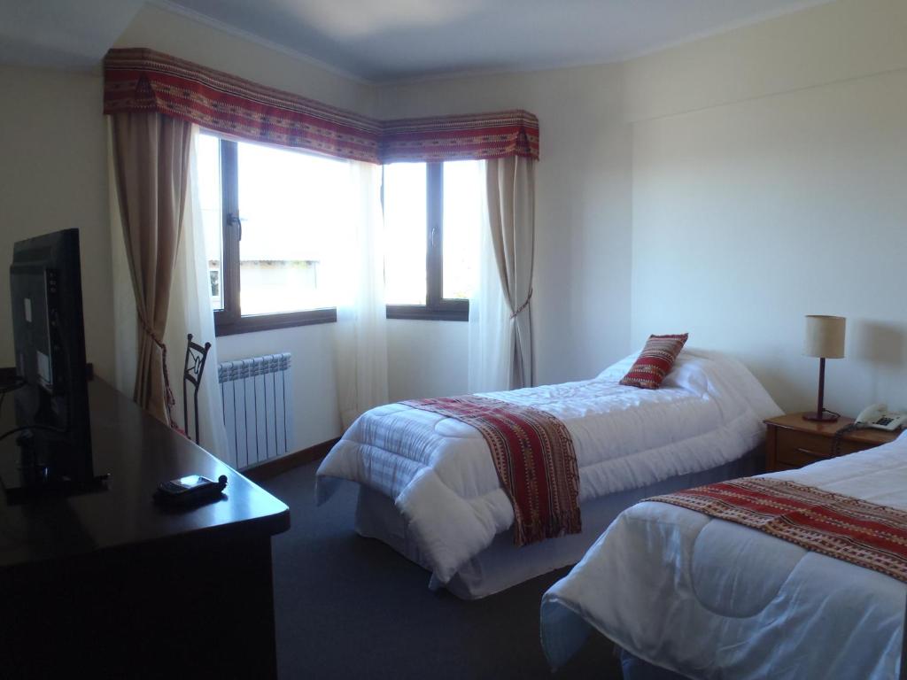 Postel nebo postele na pokoji v ubytování Hotel Cottbus