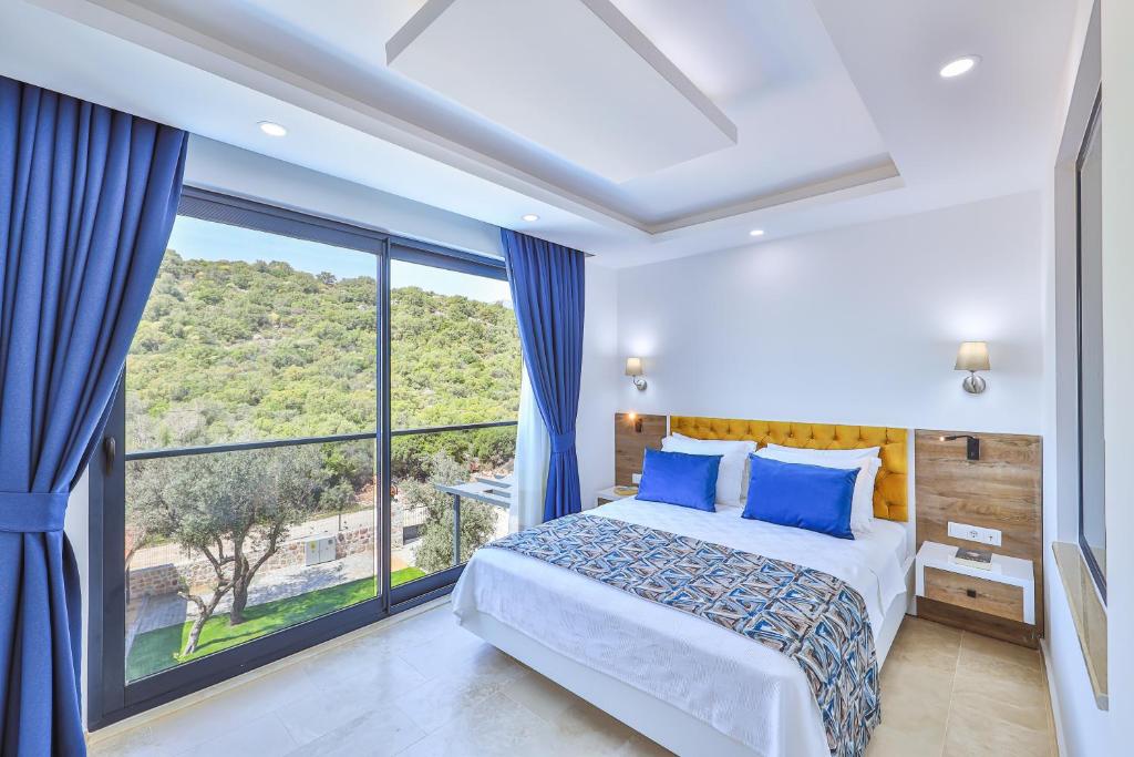 Postel nebo postele na pokoji v ubytování Villa Kas Bohem