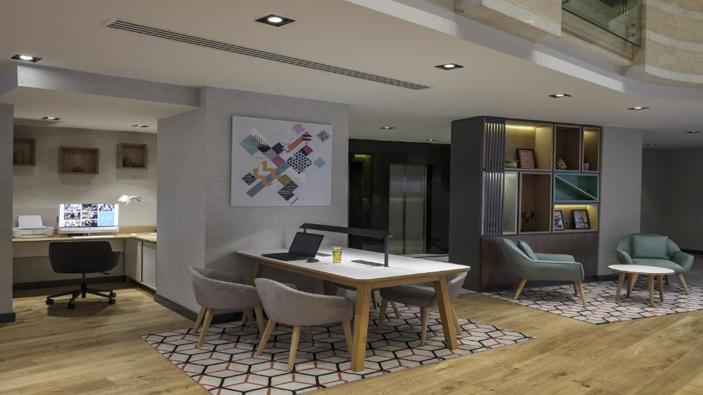 an office with a desk and chairs and a table at Holiday Inn Istanbul Old City by IHG in Istanbul