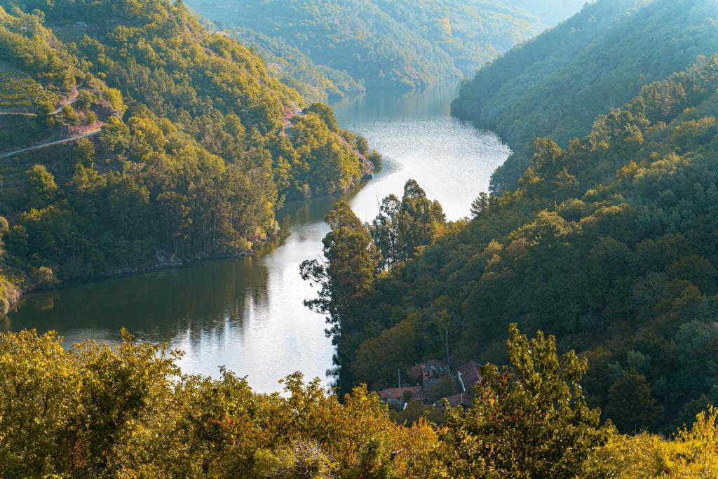 a river in the middle of a valley at Cabo Do Mundo Casa Rural in Chantada