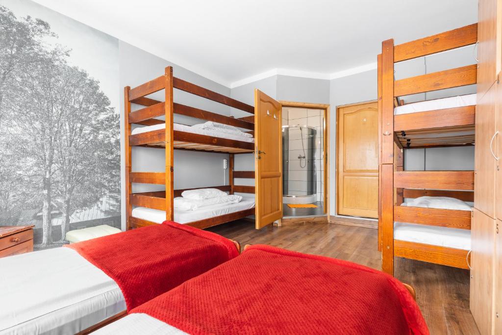 Posteľ alebo postele v izbe v ubytovaní Top Hostel Pokoje Gościnne