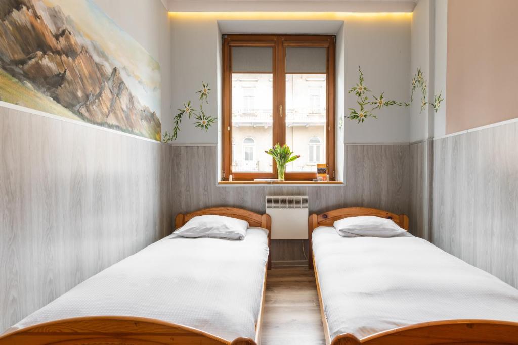Posteľ alebo postele v izbe v ubytovaní Top Hostel Pokoje Gościnne